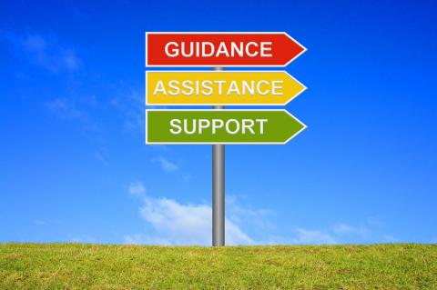 SIgn with three arrows with the words Guidance, Assistance, Support