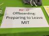 A sign with the M-I-T I-S and T logo and the words Offboarding: Preparing to leave M-I-T.